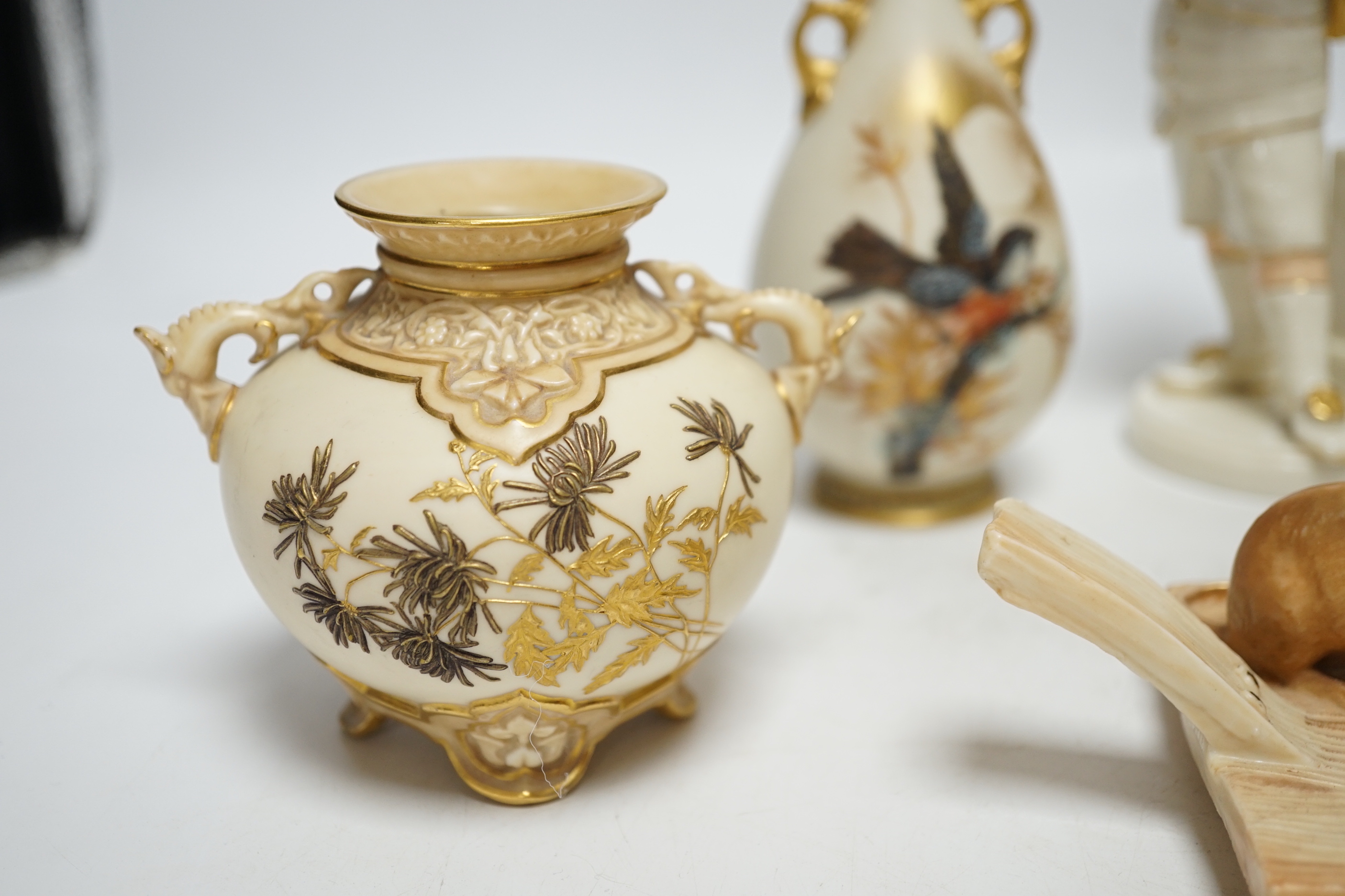 A group of five late 19th century Worcester ceramics, to include figure of a boy, a chamberstick formed as a mouse and candle, an Aesthetic period vase and a pair of bird painted vases